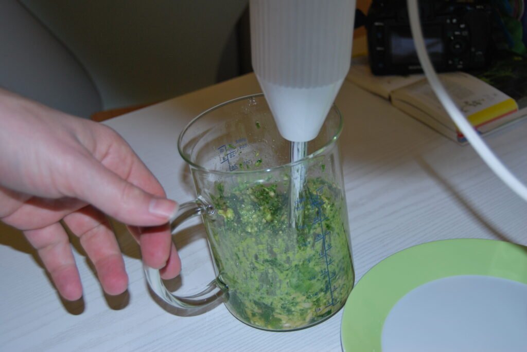 blending wild garlic pesto by hand