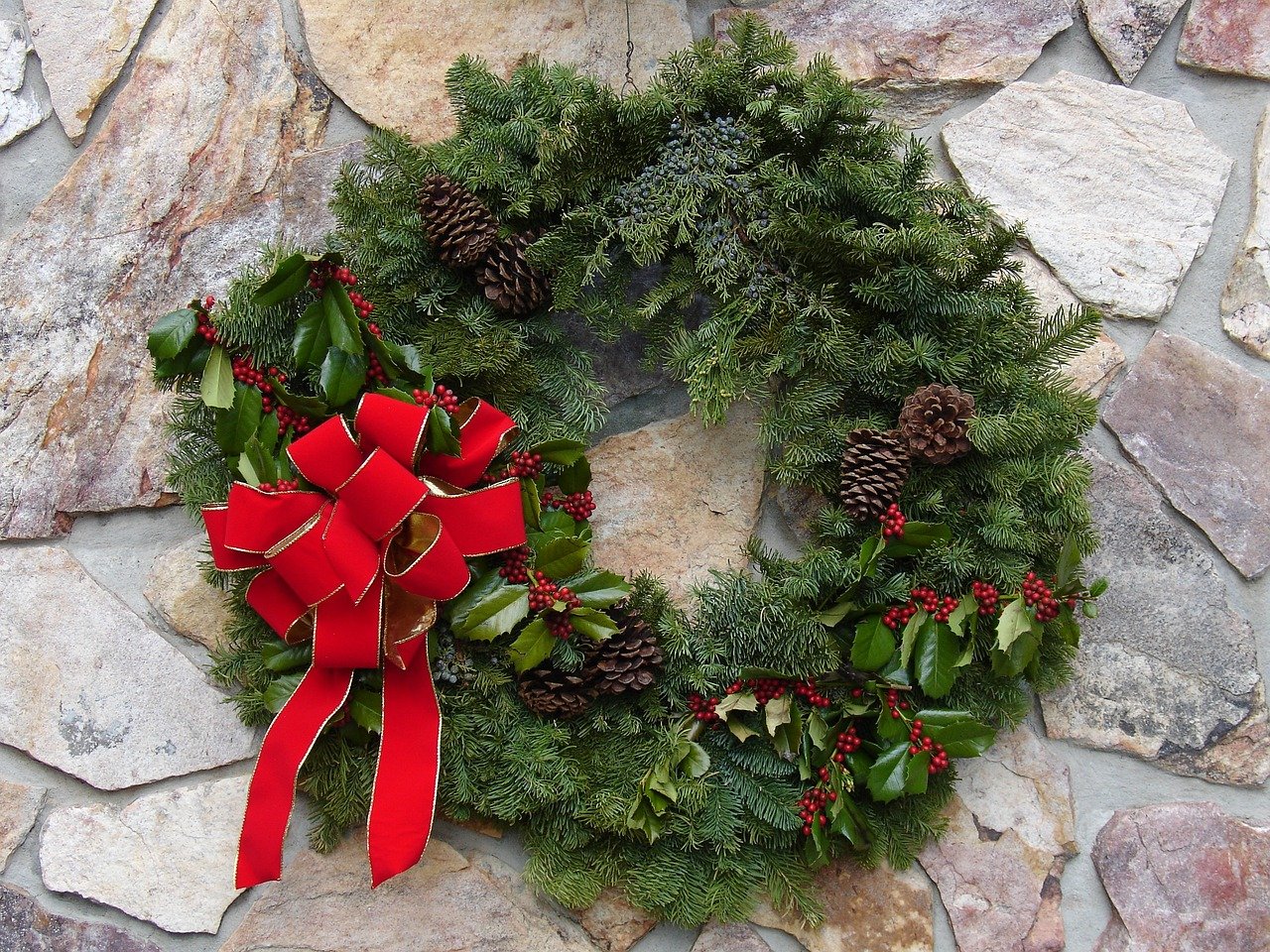 Evergreen wreath with holly and fir and juniper